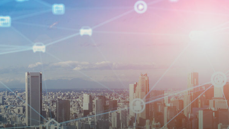 Cityscape with digital overlay of icons interconnected